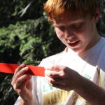 Young citizen scientist measuring wildlife.