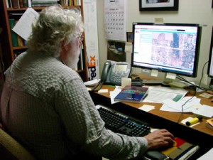 National Map Corps volunteer at the computer.