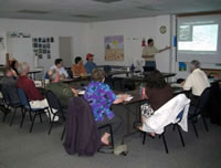 An instructor teaching a class of adults.